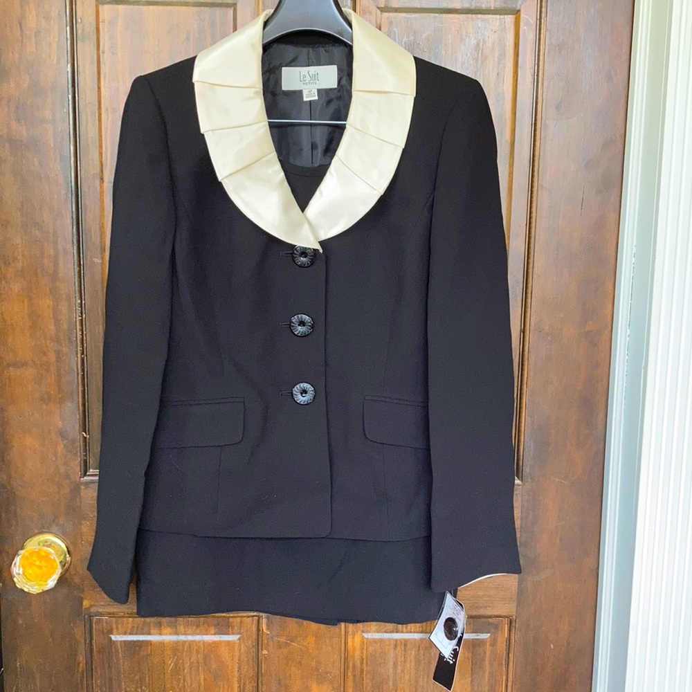Two piece black and white skirt suit. Size 4P